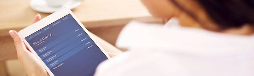 Woman using a mobile tablet for mobile banking.